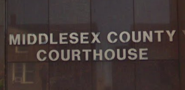 Photograph of the sign for the Middlesex County Courthouse at 56 Paterson St, New Brunswick, NJ 08903.